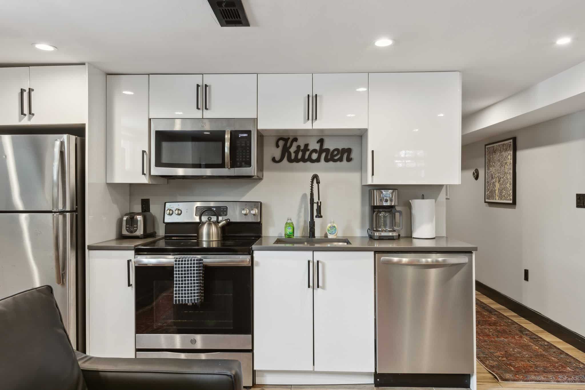 Full kitchen in a furnished Shaw, DC rowhouse apartment on O Street