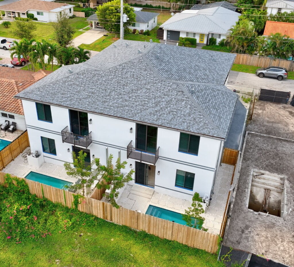 3541 NE 13th Ave from above: two new homes, two private pools