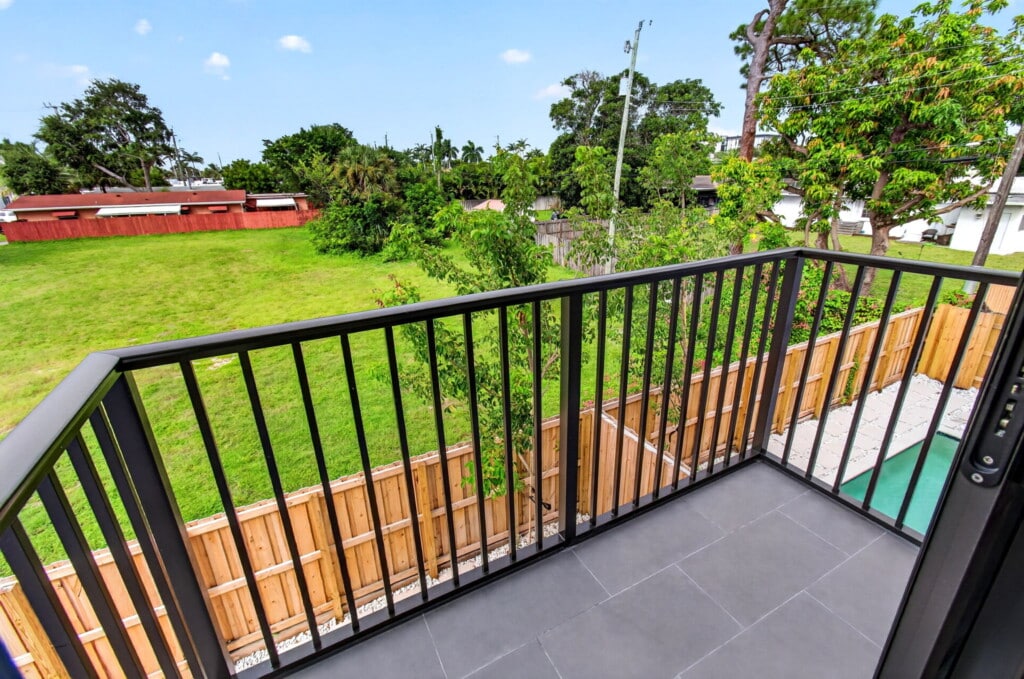 The view today from a back balcony at 3541 NE 13th Ave over the garden lots