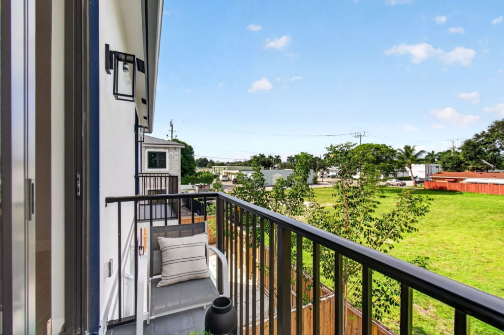3541 NE 13th Ave — balcony view over the City lots behind the homes