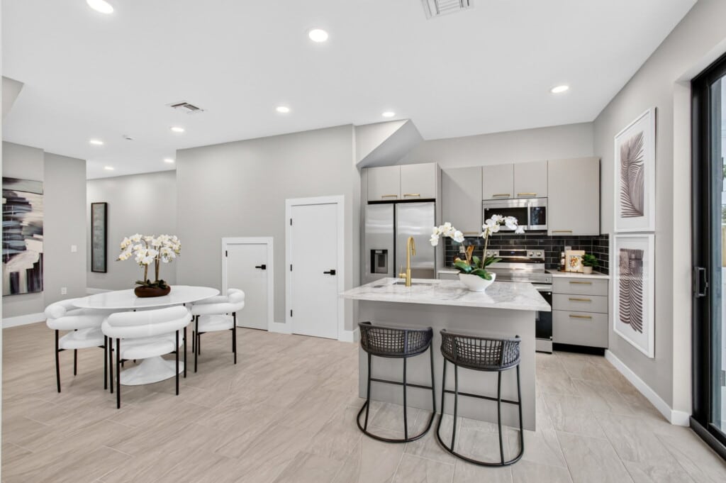 3541 NE 13th Ave, Unit B — kitchen and dining, staged